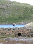 SX23583 Jenni walking over Causeway Llyn Llydaw reservoir.jpg